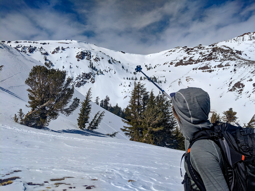 Woman-scopes-ski-line-women-in-the-backcountry-dirtbagdreams.com