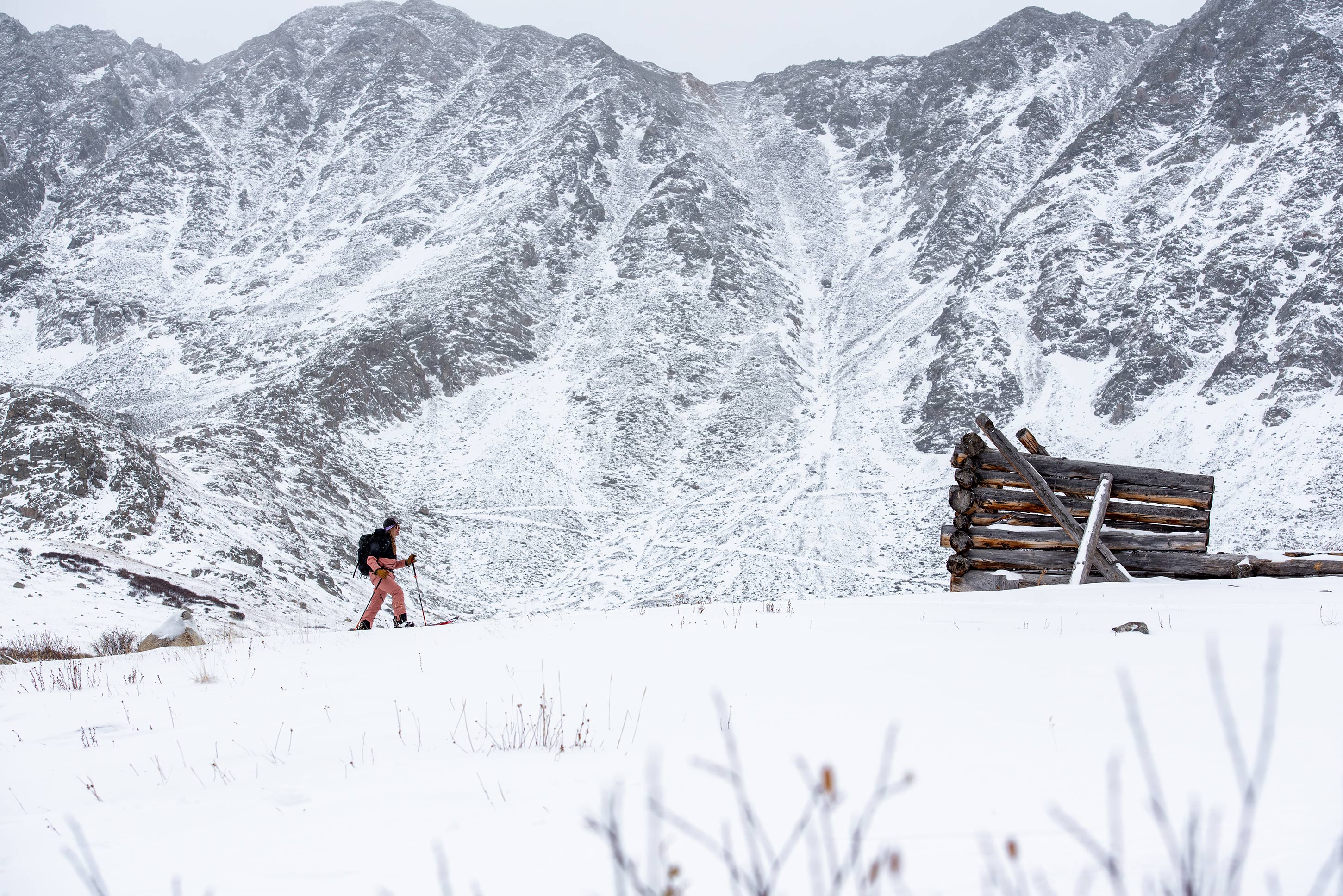 Alex Showerman splitboards up Mayflower Gulch Colorado - Photo by Carly Finke