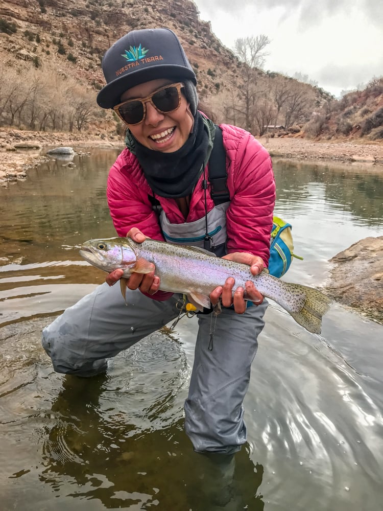 Gabaccia-Moreno-displays-catch-of-the-day--woman-flyfishing-Jicarilla-Apache-Land-Photo-Roberto-Flores-Buck