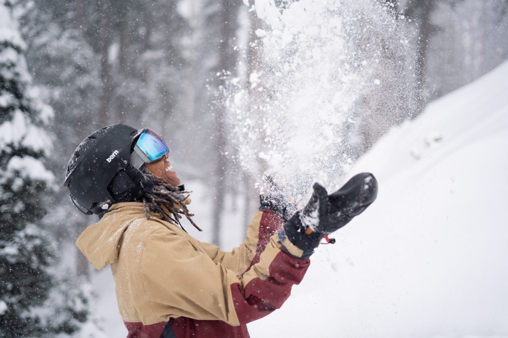 Black-History-Month-Celebrating-Black-Voices-Leaders-Outside-woman-throwing-snow-smiling